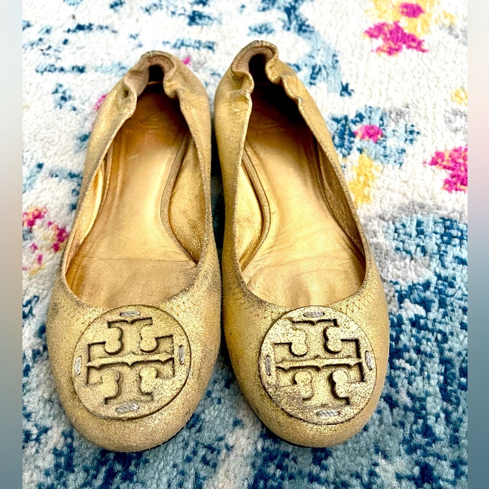 Tory Burch gold flats with logo